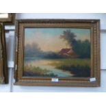 A gilt framed oil on board of cottage scene