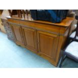 A modern sideboard having three cushion front drawers above cupboard doors CONDITION