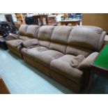 A modern three seat sofa along with a matching two seat sofa upholstered in a patterned brown