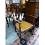 An early 20th century mahogany inlaid open armchair