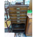 An early 20th century mahogany music cabinet