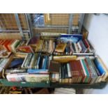 Four trays of hardback books by various authors