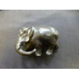 A small Japanese cast metal model of an elephant,