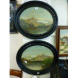 A pair of 19th century ebonised oval framed oil paintings on mountainous lake scenes