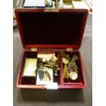 A leather covered jewellery box together with an assortment of jewellery to include chains, buttons,