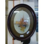 An oval framed and glazed watercolour of sailing vessels