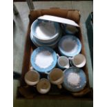 A tray of pale blue and gold rim ceramic plates, cups, saucers etc.