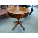 A reproduction mahogany drum table