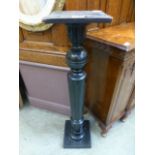 A black painted jardiniere stand