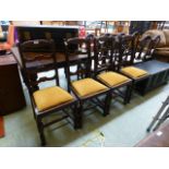 A set of four early 20th century oak framed dining chairs,