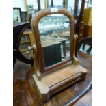 A Victorian style mahogany swing toilet mirror