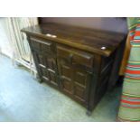 A continental oak effect cabinet having two drawers above cupboard doors