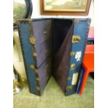 An early 20th century blue metal bound travelling case with fitted interior