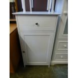 A modern white laminated pot cupboard having single drawer above cupboard door