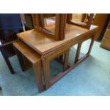 A mid-20th century teak coffee table incorporating two smaller to under