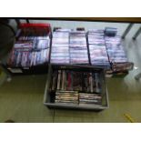 Four trays of assorted DVDs