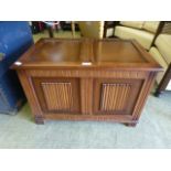 A reproduction blanket box with linen fold panels to front CONDITION REPORT: