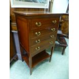 An early 20th century mahogany inlaid four draw music cabinet