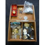 A lidded wooden box containing an assortment of pre decimal and other coinage