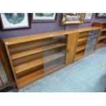 Two matching mid 20th century bookcases with sliding glazed doors,