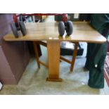 A mid-20th century drop leaf Formica top table