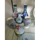 A collection of Benaya ceramics decorated in a floral manner