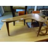 A mid-20th century pallet shaped occasional table