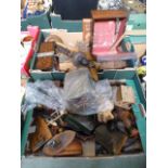 Two trays of assorted wooden items to include boomerang, model houses, tie press, boxes etc.