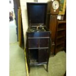 An early 20th century wind up gramophone cabinet