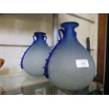 Two hand blown blue glass crackle effect vases of bulbous form