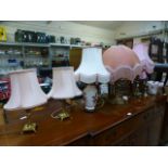 A collection of seven assorted table lamps being ceramic and brass