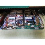 Five trays containing a large quantity of DVDs