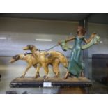 An Art Deco plaster model of a lady with two hounds CONDITION REPORT: L. 44 cm H.