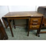 An early 20th century oak desk with one drop leaf to end and three drawers