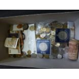 A box of assorted coinage and banknotes to include a Royal wedding £5 coin