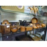 A collection of wooden treen items to include nut cracker, pots, bowls etc.