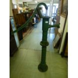 An early 20th century green painted cast iron water pump