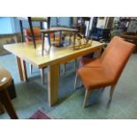 A modern sycamore effect rectangular dining table with a centre glass panel together with a set of