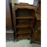 An early 20th century oak open bookcase