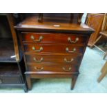 A reproduction mahogany four drawer canteen cabinet