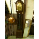 A reproduction mahogany cased grandmother clock with glazed door