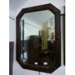 An early 20th century oak framed bevelled glass mirror