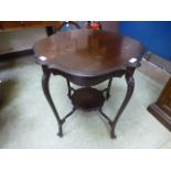 An Edwardian mahogany occasional table with under tier