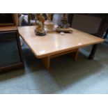 A modern oak effect square low level occasional table