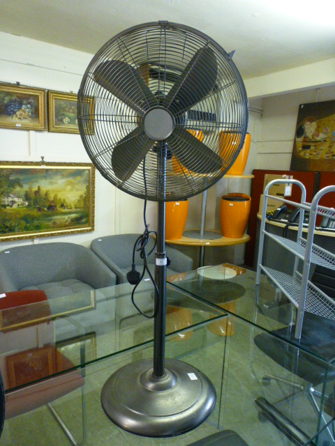 A modern fan on stand