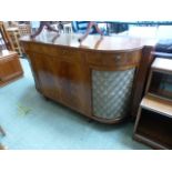 An early 20th century reproduction mahogany sideboard cabinet with lift up lid to centre,