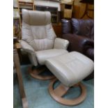 A tan leather swivel chair with matching stool