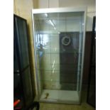 A metal framed display cabinet with four adjustable shelves and lockable doors, h.