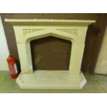 A modern painted plaster fire surround