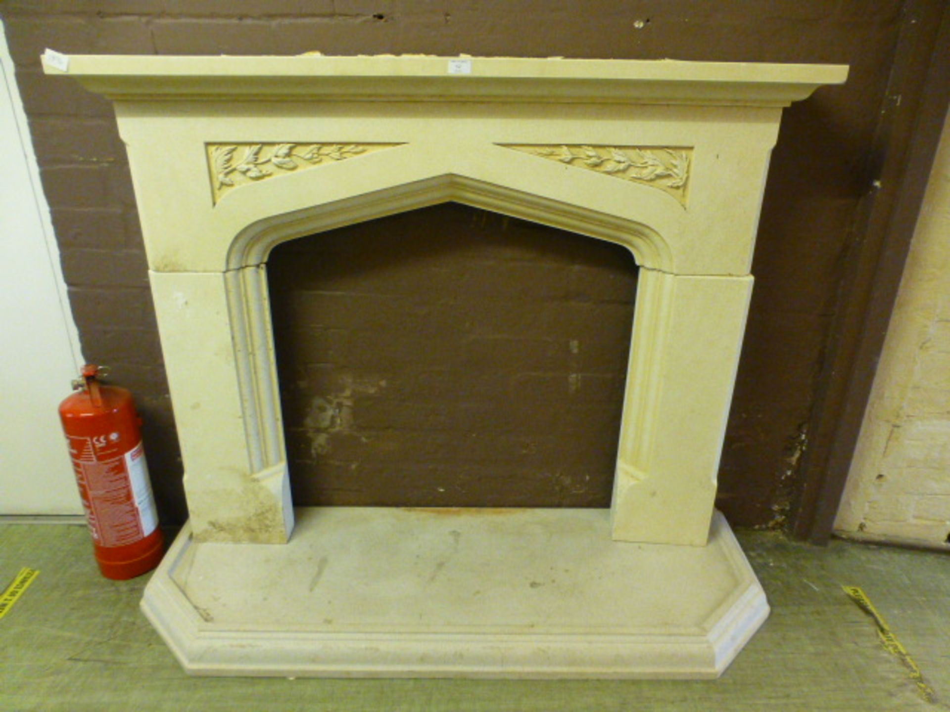 A modern painted plaster fire surround